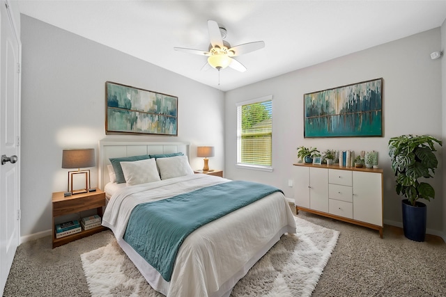 bedroom featuring light carpet and ceiling fan