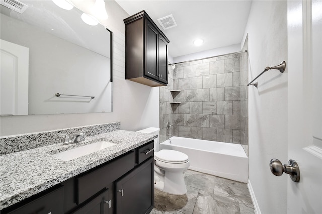 full bathroom with vanity, toilet, and tiled shower / bath