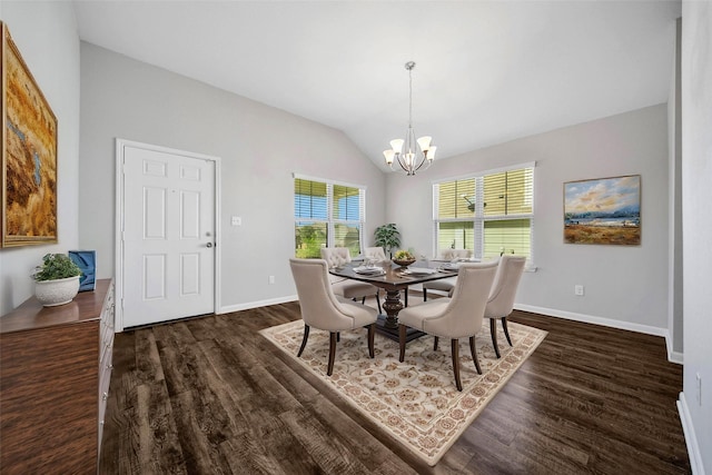 dining space featuring dark wood-type flooring, a chandelier, and vaulted ceiling