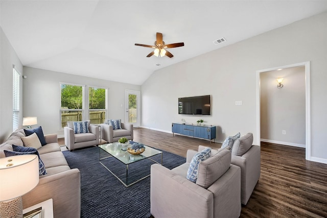 living room featuring lofted ceiling, ceiling fan, dark hardwood / wood-style flooring, and plenty of natural light