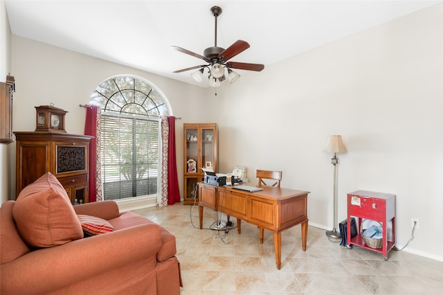 tiled office space with ceiling fan