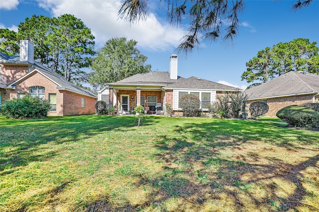 view of front of home with a front lawn