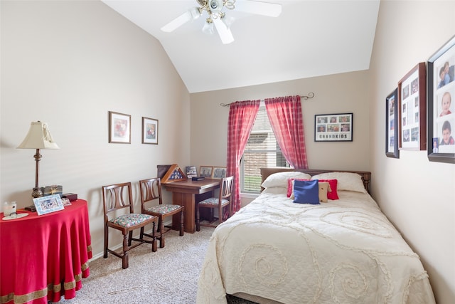 carpeted bedroom with ceiling fan and vaulted ceiling