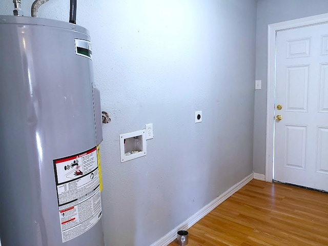 washroom featuring washer hookup, hardwood / wood-style flooring, water heater, and electric dryer hookup