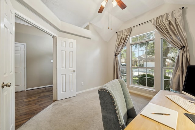 office featuring dark wood-type flooring, vaulted ceiling, and ceiling fan