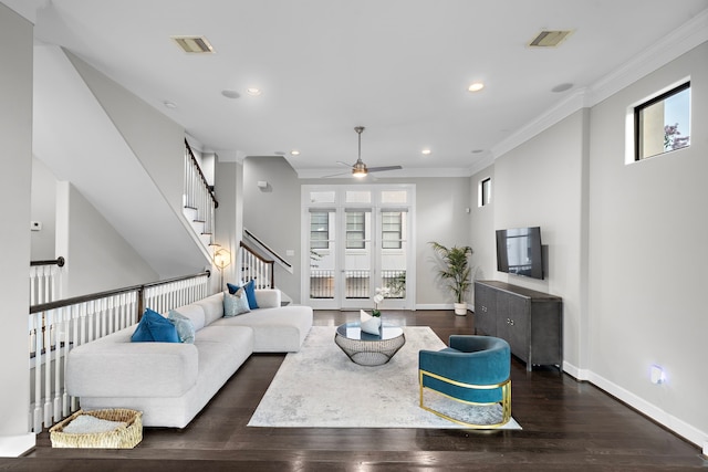 living room with crown molding, ceiling fan, and dark hardwood / wood-style flooring