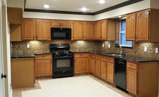 kitchen with tasteful backsplash, ornamental molding, black appliances, and sink