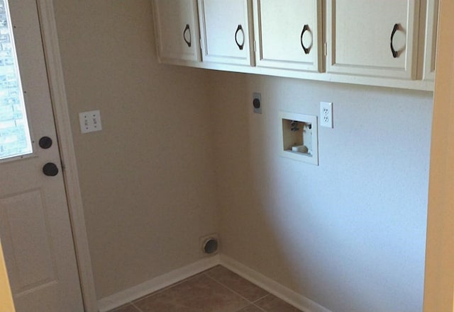 laundry area with washer hookup, hookup for an electric dryer, tile patterned floors, and cabinets