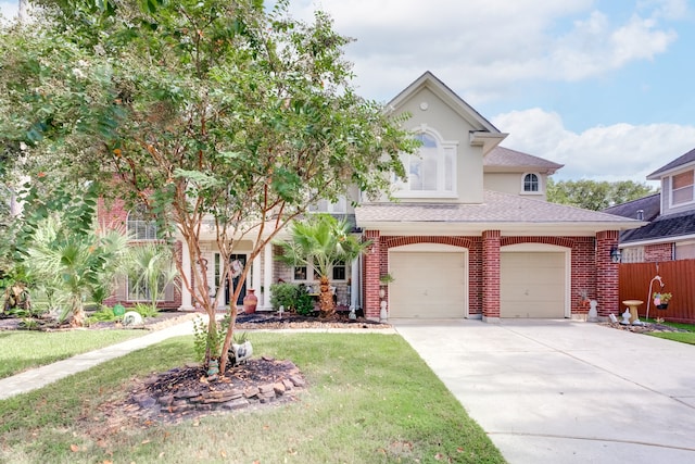 view of front facade with a front yard and a garage