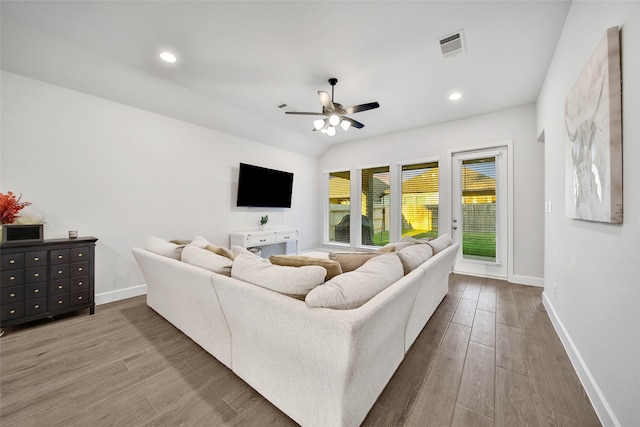 living room with ceiling fan and wood-type flooring