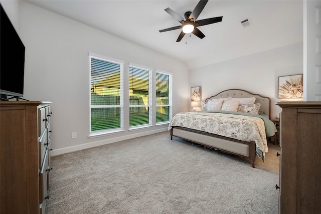 carpeted bedroom featuring lofted ceiling and ceiling fan