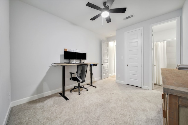 office space featuring ceiling fan and carpet