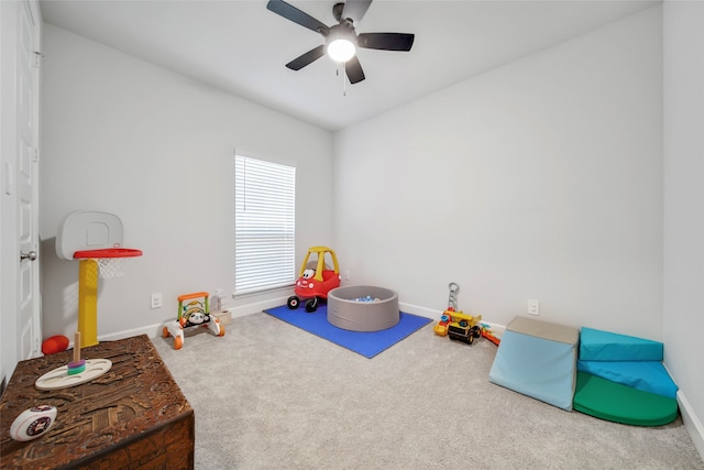 recreation room with ceiling fan and carpet flooring