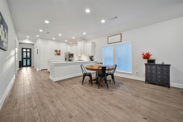 dining room featuring light hardwood / wood-style flooring