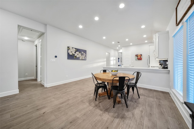 dining room featuring light hardwood / wood-style flooring