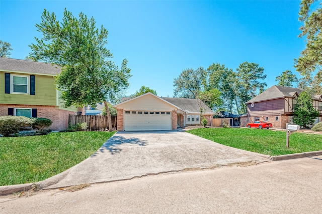 view of front facade featuring a garage and a front lawn