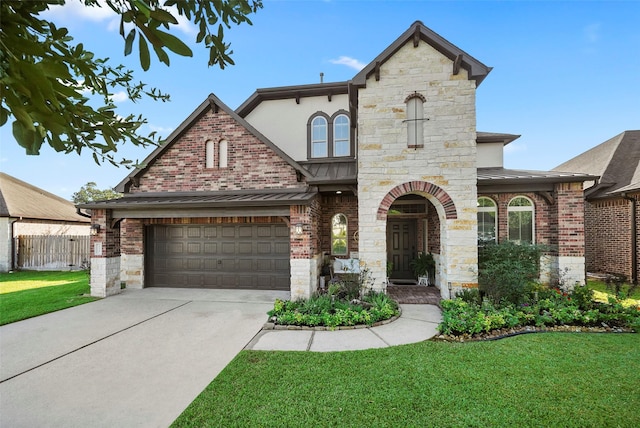 view of front of house featuring a garage and a front yard