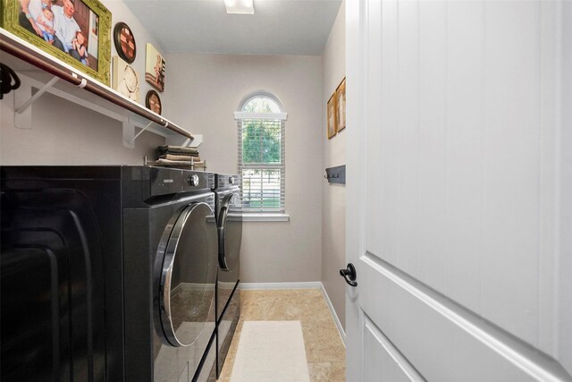 226 Hampton Glen Rd, Montgomery, TX 77356 - laundry area with baseboards, washer and dryer, and laundry area