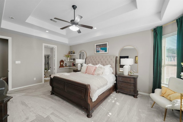226 Hampton Glen Rd, Montgomery, TX 77356 - carpeted bedroom with visible vents, baseboards, a ceiling fan, and a tray ceiling