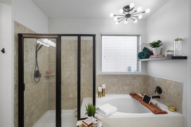 bathroom with a notable chandelier and plus walk in shower