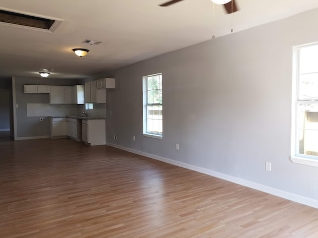 unfurnished living room featuring light wood-type flooring