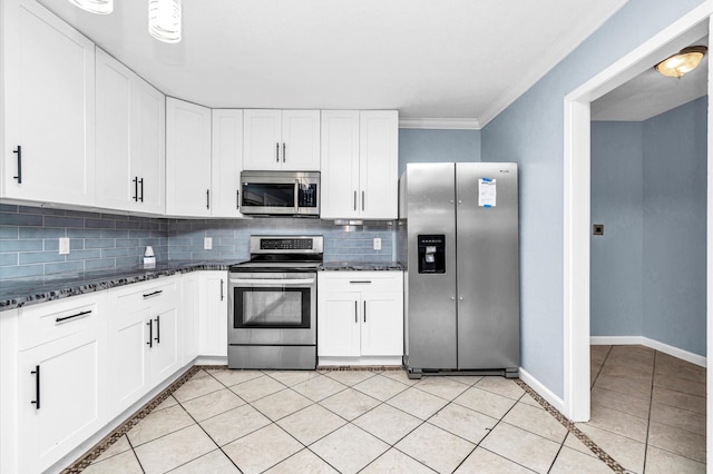 kitchen featuring stainless steel appliances, backsplash, ornamental molding, and white cabinetry