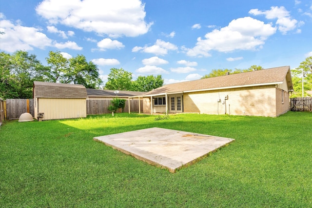 view of yard featuring a patio and a shed