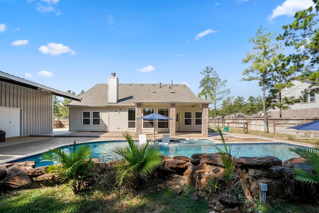 view of swimming pool with a patio area