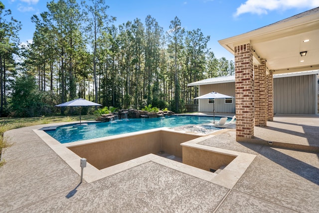 view of swimming pool featuring a patio area and pool water feature