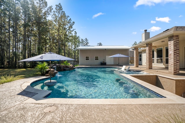 view of swimming pool with a patio area and pool water feature