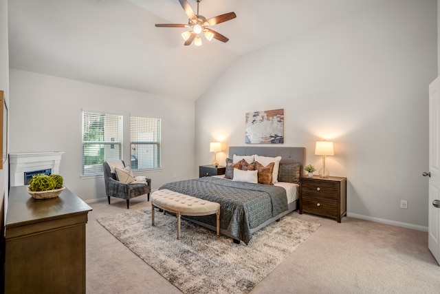 carpeted bedroom with ceiling fan and lofted ceiling