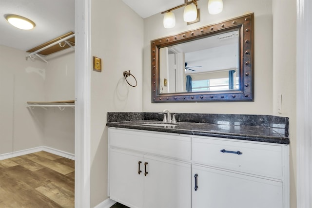 bathroom with vanity and hardwood / wood-style flooring