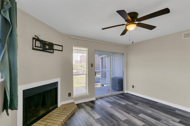 living room with ceiling fan and dark hardwood / wood-style flooring