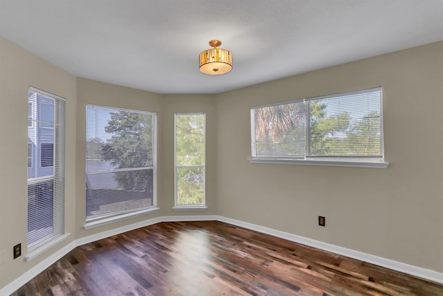 unfurnished room featuring dark hardwood / wood-style floors