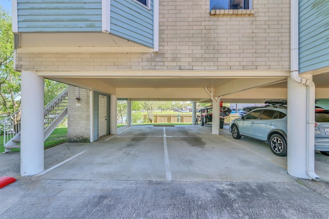 view of parking / parking lot featuring a carport