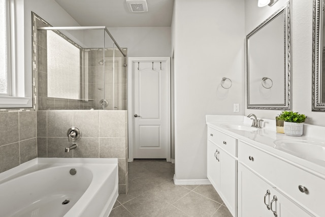 bathroom featuring tile patterned flooring, separate shower and tub, and vanity