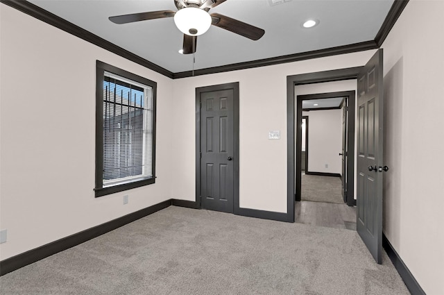 unfurnished bedroom featuring a ceiling fan, carpet floors, baseboards, ornamental molding, and recessed lighting
