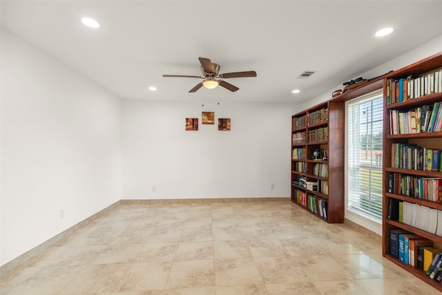 unfurnished room with ceiling fan