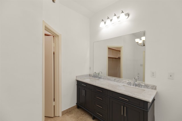 bathroom featuring tile patterned flooring and vanity