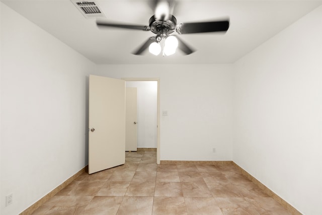 spare room with ceiling fan