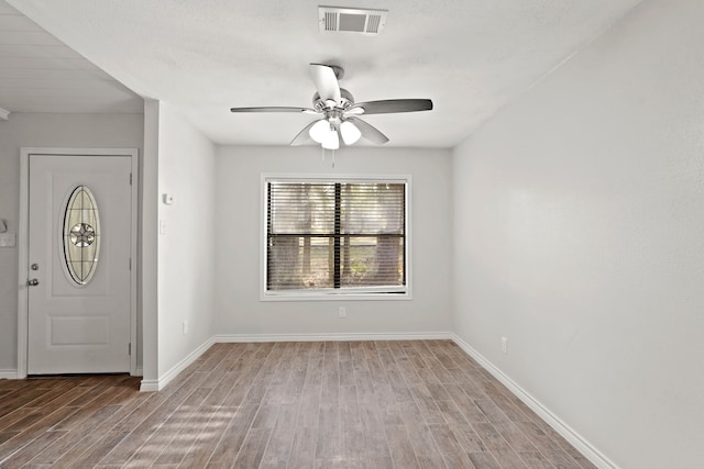 foyer with light wood-type flooring and ceiling fan