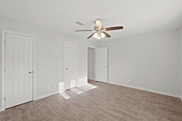 unfurnished room featuring ceiling fan and light hardwood / wood-style flooring