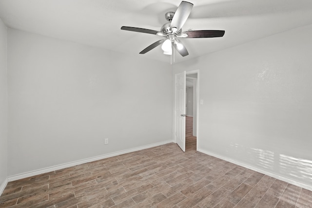 spare room featuring light wood-type flooring and ceiling fan