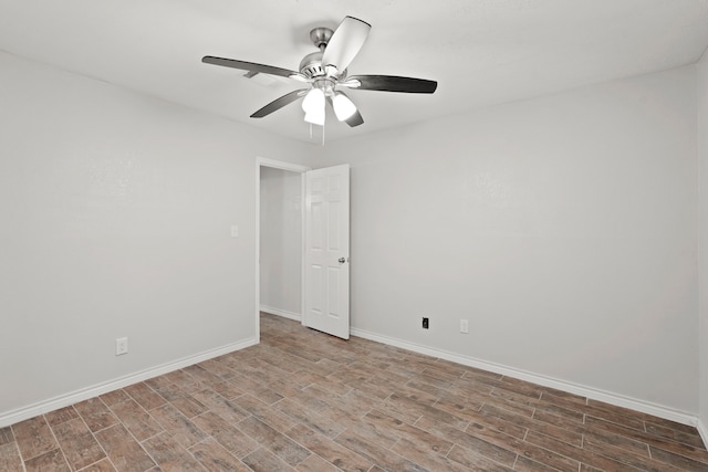 empty room featuring ceiling fan and wood-type flooring