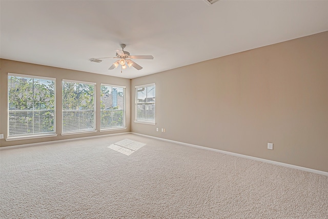 spare room with ceiling fan and carpet floors