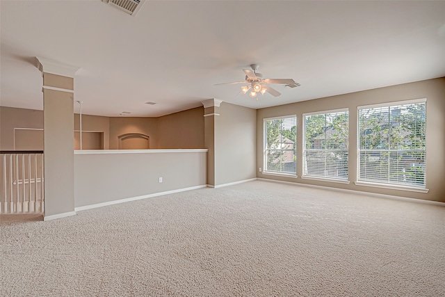 empty room with ceiling fan and carpet floors