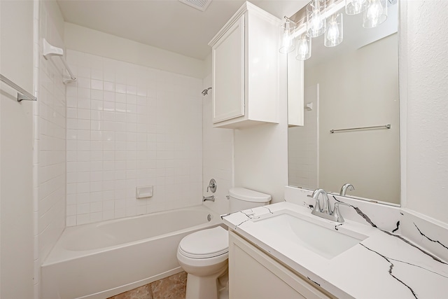 full bathroom featuring vanity, toilet, and tiled shower / bath