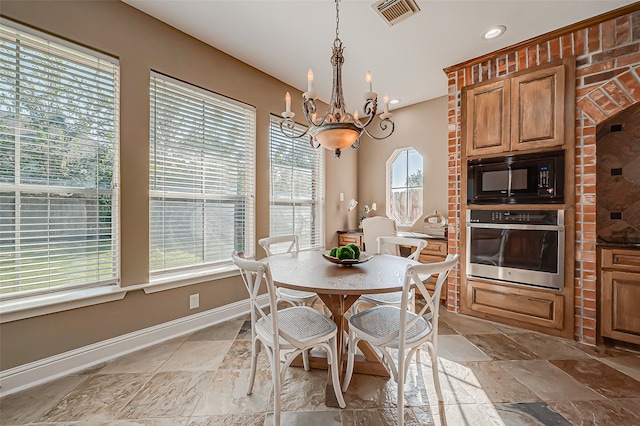 dining area with a notable chandelier