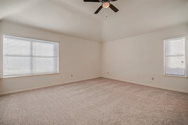 unfurnished room with light colored carpet and a healthy amount of sunlight