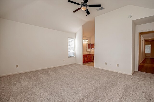 2810 Pineleaf Dr, Sugar Land, TX 77479 - unfurnished room with vaulted ceiling, light colored carpet, ceiling fan, and baseboards